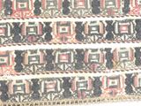 a close up of a rug with many different designs on it