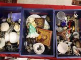 two bins filled with assorted items sitting on a table