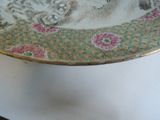 a plate with a cat on it sitting on a table