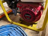 an image of a red and white water pump in a warehouse
