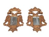 paire de miroirs dorés ornés de têtes d'aigle et d'un miroir au centre