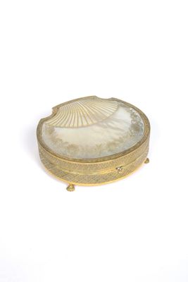 an image of a shell shaped box sitting on top of a white surface