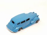a blue toy car that is sitting on a white surface