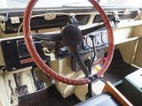 a steering wheel and dashboard of an old car