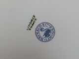 a close up of a plate with a bird on it