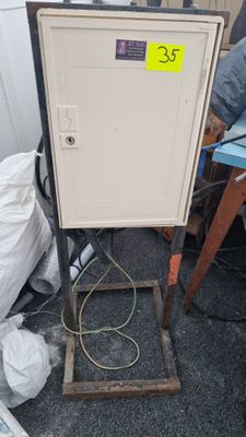 a metal cabinet that has a price tag on it