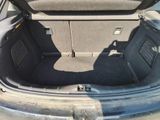 a trunk of a car with the back seats folded down