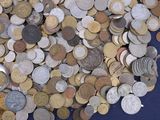 a pile of coins on a blue surface