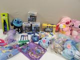 a lot of stuffed animals and toys on a table