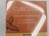 a close up of a box of curcula pads on a table