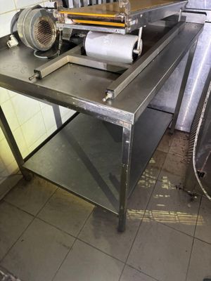 a machine that is sitting on a table in a kitchen