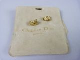 pair of christian dior earrings in yellow gold