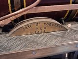 a close up of a train engine with a barrel on the side