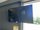 a flat screen tv mounted on a wall in a room