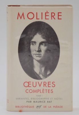 an old book with a picture of a woman in a black and white photo