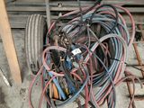 a pile of wires on a cart in a garage