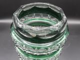 a glass vase that is sitting on a table