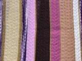 purple, brown, and white striped blanket hanging on a clothes line