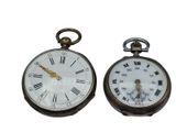 two clocks that have roman numerals on them
