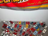 a lot of toy cars that are on a table