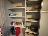 a pantry with a lot of food on the shelves