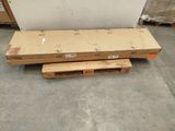 a pallet that is sitting on the floor next to some boxes