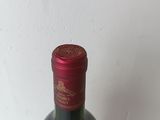 a bottle of wine that is sitting on a table