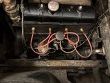 a picture of an old car with no engine on it