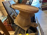 a wicker basket on top of a chair in a room