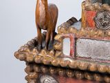 a statue of a horse on top of a box