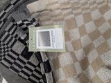 a close up of a piece of fabric with a label on it