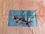 a picture of a piece of cloth with birds on it