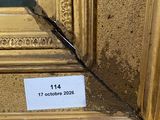 an image of a painting of a gold frame with a label on it