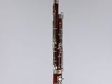 a close up of a bassoon on a clear stand
