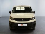 a white van parked in a room with a sign on the front of it
