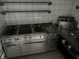 an image of a kitchen with a stove and a sink