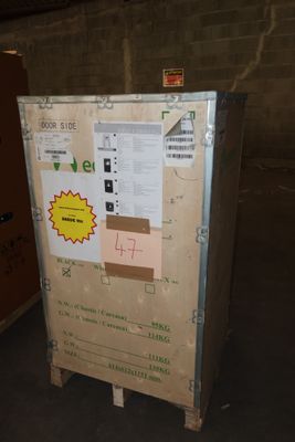 a refrigerator that is sitting in the middle of a room