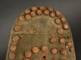 a close up of a shoe with holes in the sole