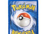 a close up of a pokemon card on a white surface