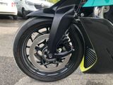 a close up of a motorcycle parked in a parking lot