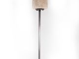 a stone vase on a metal stand on a white background