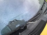 a close up of the windshield of a car with rain on it