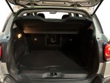 a trunk of a small car with the back door open