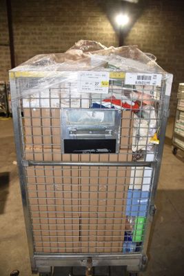 a metal cart with a bunch of boxes on top of it