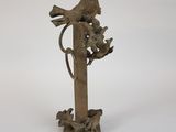 statue of a bird on a branch with birds on it