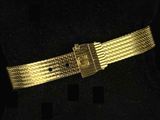 a close up of a gold belt on a mannequin mannequin mannequin mannequin mannequin mannequin mannequin manne