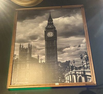 a picture of big ben on the wall of a restaurant