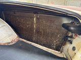 a dirty door of a car that has been left open