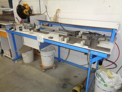 a picture of a machine that is working on a piece of metal
