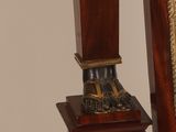 a clock that is sitting on top of a wooden stand